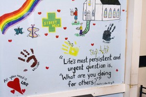 A painting made by a Street Help client with a Martin Luther King Jr quote, hangs on the wall of the centre