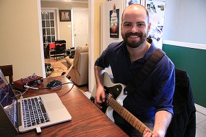Luc Michaud lays down guitar tracks from Highland Studios based in his home. (Todd Shearon)