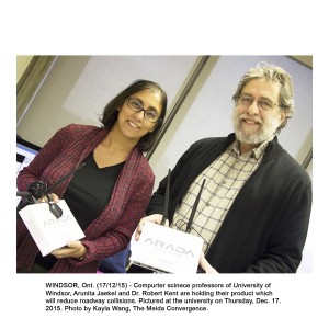 WINDSOR, Ont. (17/12/15) - Computer science professors of University of Windsor, Arunita Jaekel and Dr. Robert Kent are holding their product which will reduce roadway collisions. Pictured at the university on Thursday, Dec. 17. 2015. Photo by Kayla Wang, The Media Convergence.