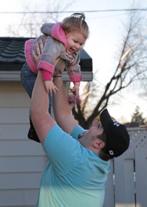 WINDSOR, Ont. (15/11/15) - Sasha LePage is lifted into the air by her father Joseph in the backyard of their home on Bernard Road in Windsor on Sunday, Nov. 15, 2015. Photo by Sean Previl. The Converged Citizen.