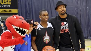 Catholic Central High School graduate Shavon Gayle (second right) poses for a picture with NBA All-Star Weekend celebrity guest Morris Peterson (right) at the St. Dennis Centre in Windsor on Jan. 16. Gayle won the dunk competition and will now head to Toronto for a chance to participate in the NBA All-Star Weekend Feb. 12-14.