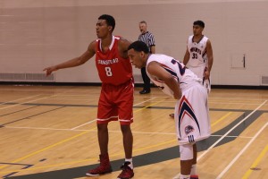 Isaiah Familia (right) rests during an early season game during the Freed's invitational tournament 