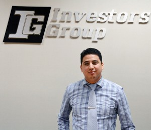 Jeff Castaneda is a financial planner at IG Investors Group and poses in fron of the company logo on Feb.19.
