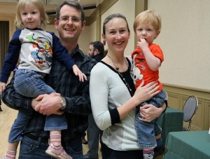 Bruce and Michelle Arther, with their 3-year-old daughter Elisabeth, left, and 2-year-old son Nathan visit the City of Windsor Open House  at the Giovanni Caboto Club on Feb. 8 to hear more about park upgrades. 