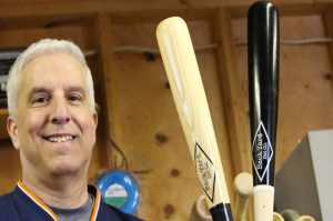 John LaMantia poses with his Back-Yard Bat Co. baseball bats. (Photo by Christian Bouchard)
