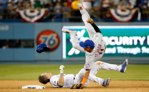 Chase Utley (bottom) slides into New York Mets infielder Ruben Tejada. The slide left Tejada injured and has since been a large reason in MLB’s new rule implementation of player safety when sliding into second base. (Photo courtesy of forbes.com)