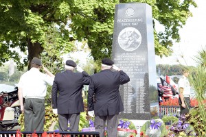 Three soldiers salute the Afghanistan memorial on September 11, 2016 at the Coventry Garden on Pilette and Riverside in Windsor Ontario. Photo by Kati Panasiuk. 