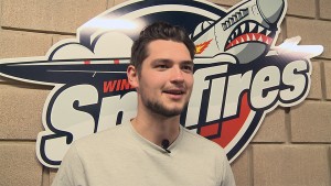 Windsor Spitfires centre Logan Brown answers questions outside the team dressing room at the W.F.C.U. Centre. Photo by Todd Shearon