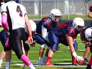 Holy Names quarterback Inho Choi lines up under center during a WECSSAA regular season game. (Photo by Norma O'neil Williams)