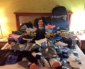 Beer mile world record holder Corey Bellemore with some of the apparel he received following the signing of his sponsorship with Adidas. (Photo courtesy of Corey Bellemore)