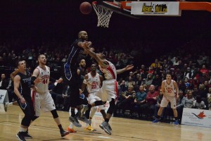 Maurice Jones (middle) goes up for the layup against the Kitchener-Waterloo Titans [Photo and caption by Jeremy James Fokuoh]