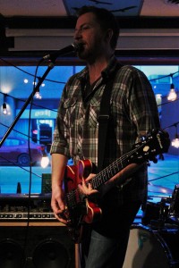 Todd Shearon plays double duty as both host and performer of the MediaPlex Meltdown that was held at Phog Lounge on April 4. Photo by Dawn Gray