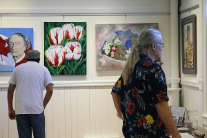 Visitors are enjoying the displayed art works at the Gibson Gallery in Amherstburg on Saturday, Sept. 16, 2017.The Gibson Gallery of Amherstburg organize this juried art show to celebrate Canada 150 birthday. (Photo by: MD NURUZZAMAN) 