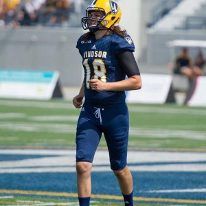 Clark Green runs onto the field during a home game at Alumni Field (Photo courtesy of Windsor Lancers Photo Team) 