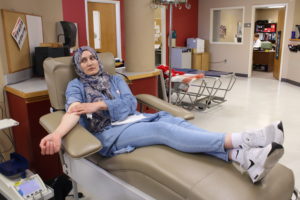 Lina Almhagareish applies pressure to her arm after donating blood at the Canadian Blood Service on Monday, Sept. 17, 2018.