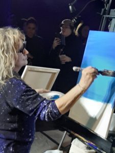 Artist Judy DePassio painting her mastepiece in the second round of Art Battle
