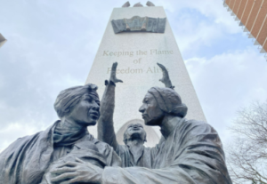 A statue of freed slaves, depicting a message of freedom saying “Keeping the Flame of Freedom Alive” in downtown Windsor, photo by Colin Bannon.